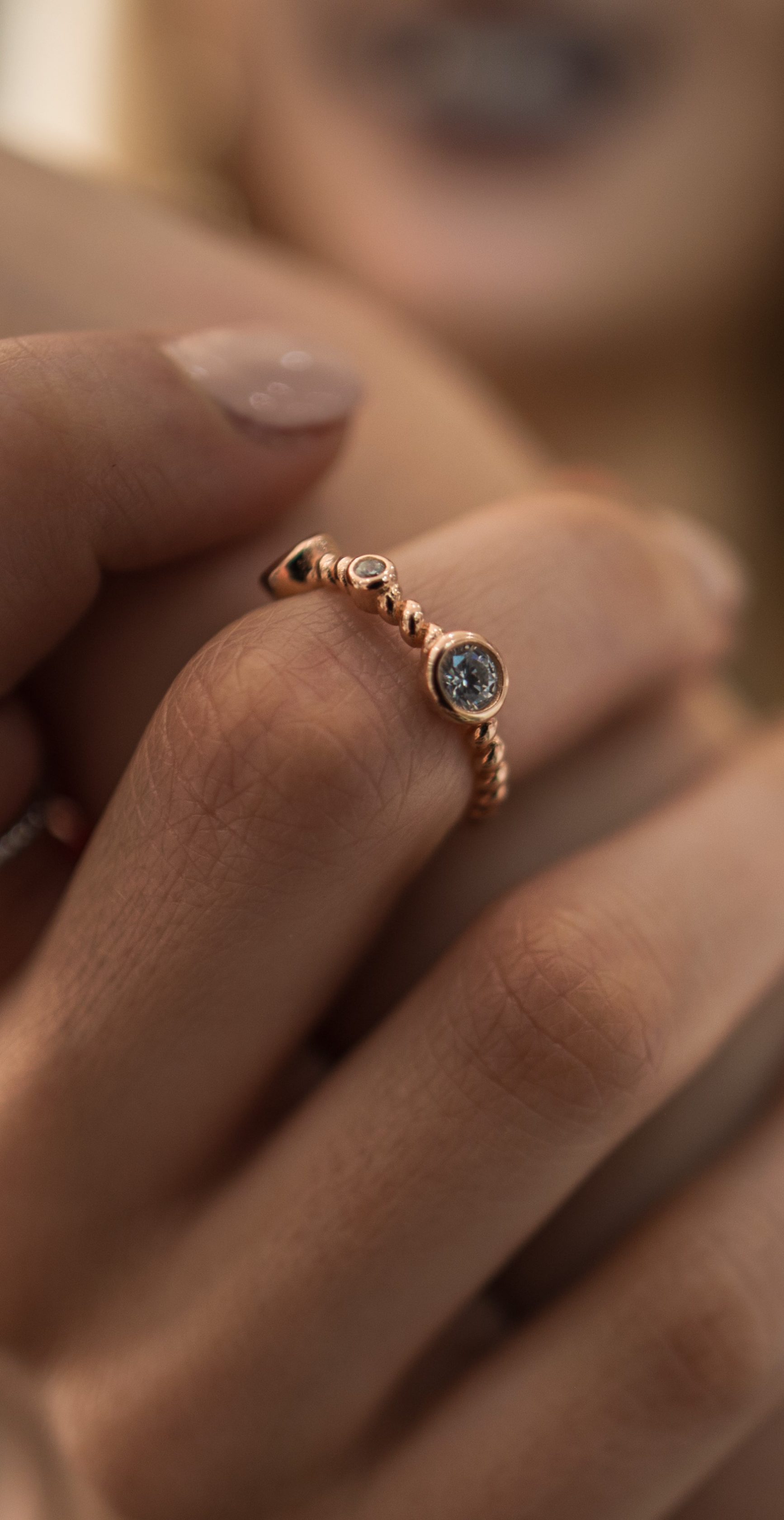 Woman showcasing jewelry on her hands