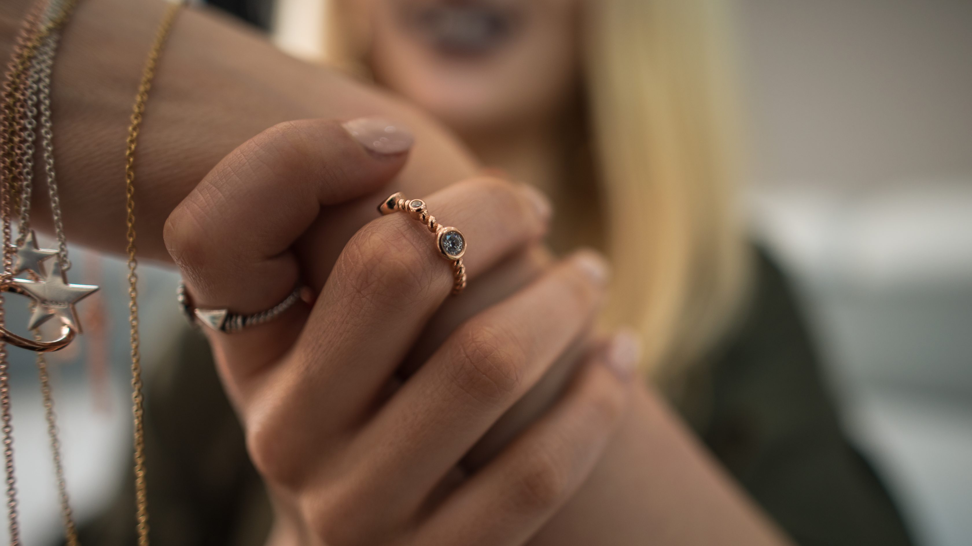 Woman showcasing jewelry on her hands